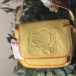 Pastel Yellow Crossbody Bag with Embossed Rose Design